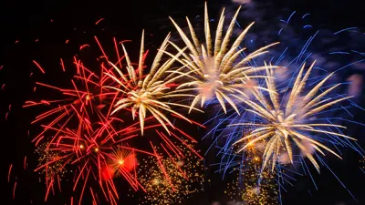 Photo of colourful fireworks in the night sky.