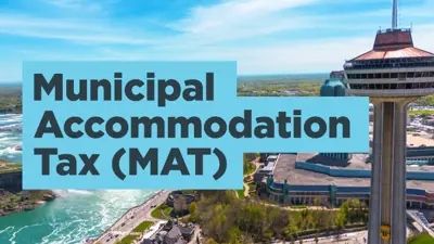 Municipal Accommodation Tax (MAT) with the Niagara Falls and buildings in the background.