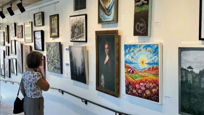 A person viewing art on display at the Niagara Falls Exchange.