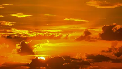 Hot sun in a hazy orange sky.