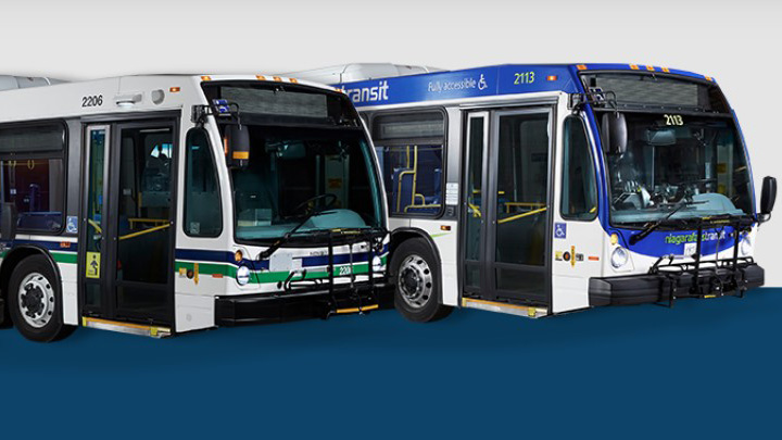 Two Niagara Region transit buses parked side by side.