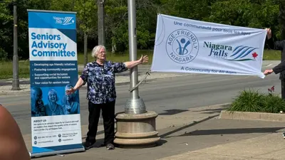 Flag being raised for Senior's Month at City Hall in Niagara Falls Ontario.