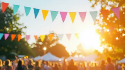 Blurred image of an outdoor event with white tents and the public gathering.