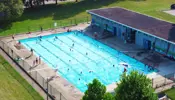 An overhead photo of F.H. Leslie outdoor public pool and the pool building.