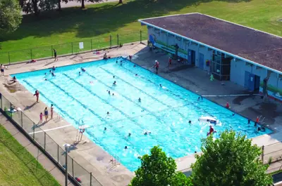 An overhead photo of F.H. Leslie outdoor public pool and the pool building.