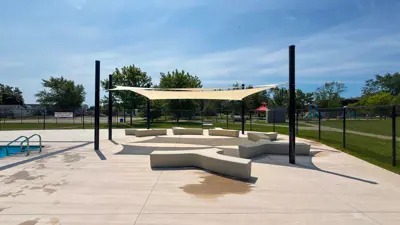 Prince Charles pool deck with new seating and shade shelter.