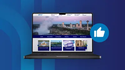 Decorative image of a laptop showing the new homepage of the City of Niagara Falls website, on a blue background