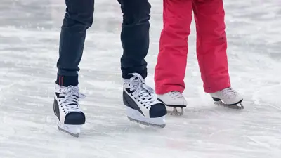 Legs of people skating close up