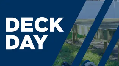 A wooden deck being built with a blue striped graphic and white text "Deck Day".