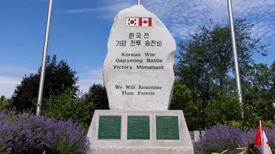 Korean Ware Gapyeong battle victory monument. Erect stone monument with Korean and Canadian flag and three plaques.